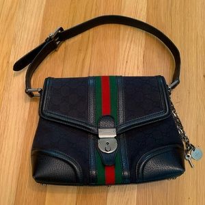 SOLD Gucci shoulder bag. Signature pattern with silver hardware.
